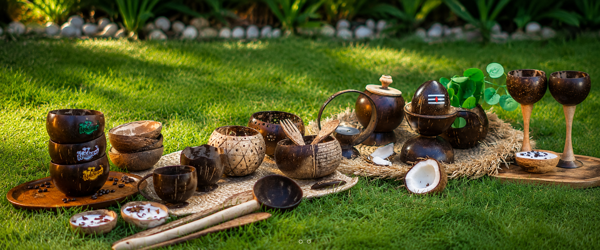 Natchu's coconut shell cups, bowls and spoons styled together on green grass